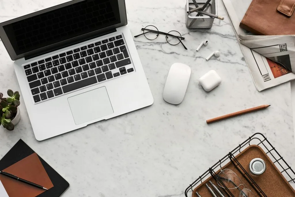 pexels-photo-3184454-3184454 Discover a clean, organized workspace featuring a laptop, AirPods, and stationery essentials on a marble desk.